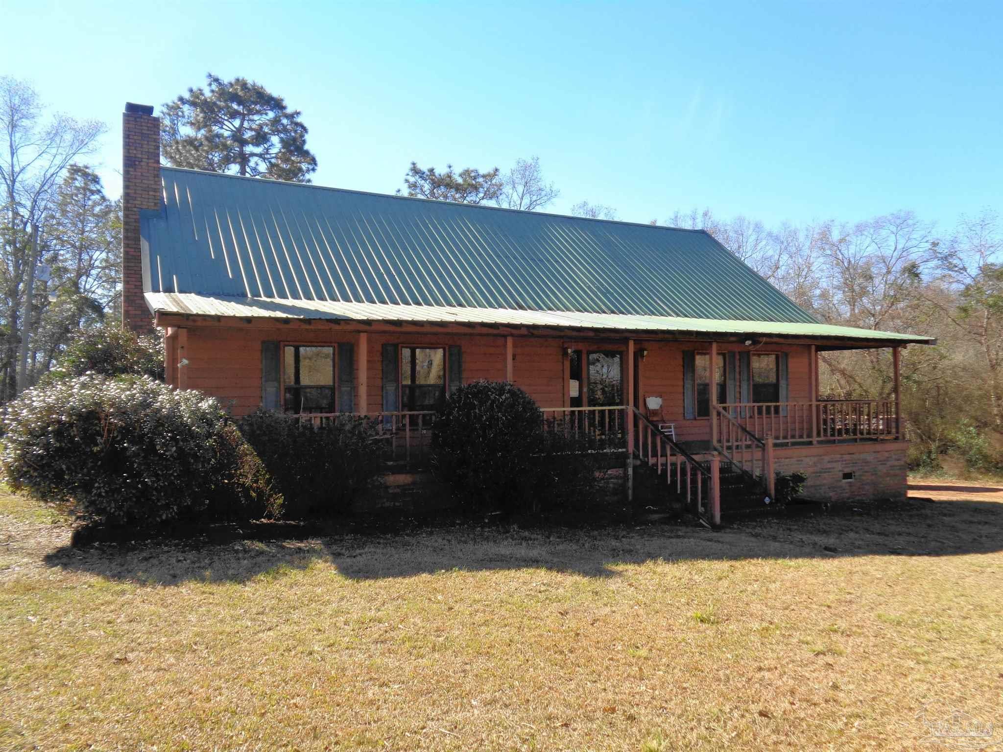 252 S Road Atmore, AL 36502 - Photo 3 of 40 a front view of a house with a yard