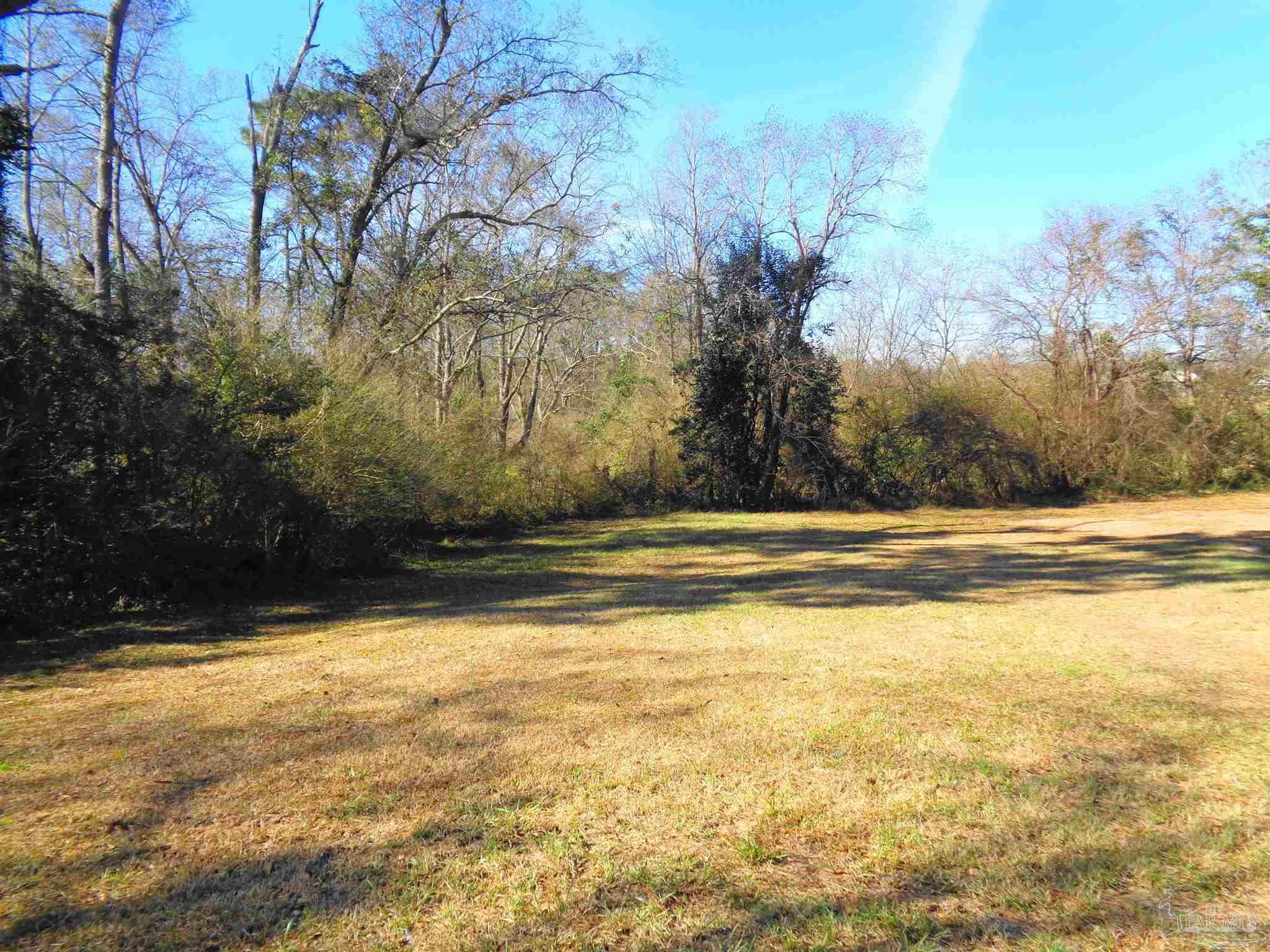 252 S Road Atmore, AL 36502 - Photo 31 of 40 a view of swimming pool with an outdoor space and seating area