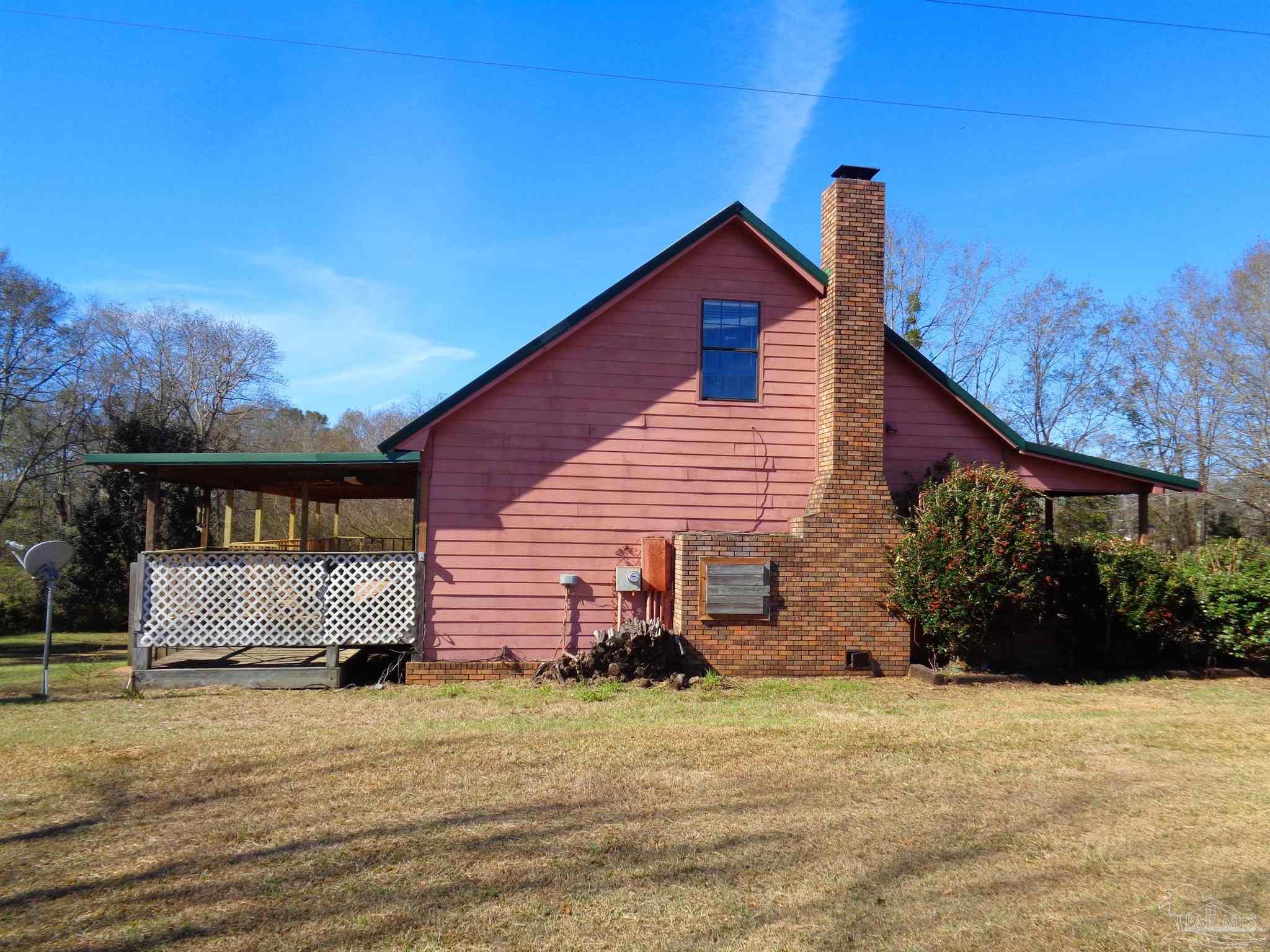 252 S Road Atmore, AL 36502 - Photo 34 of 40 a front view of a house with a yard