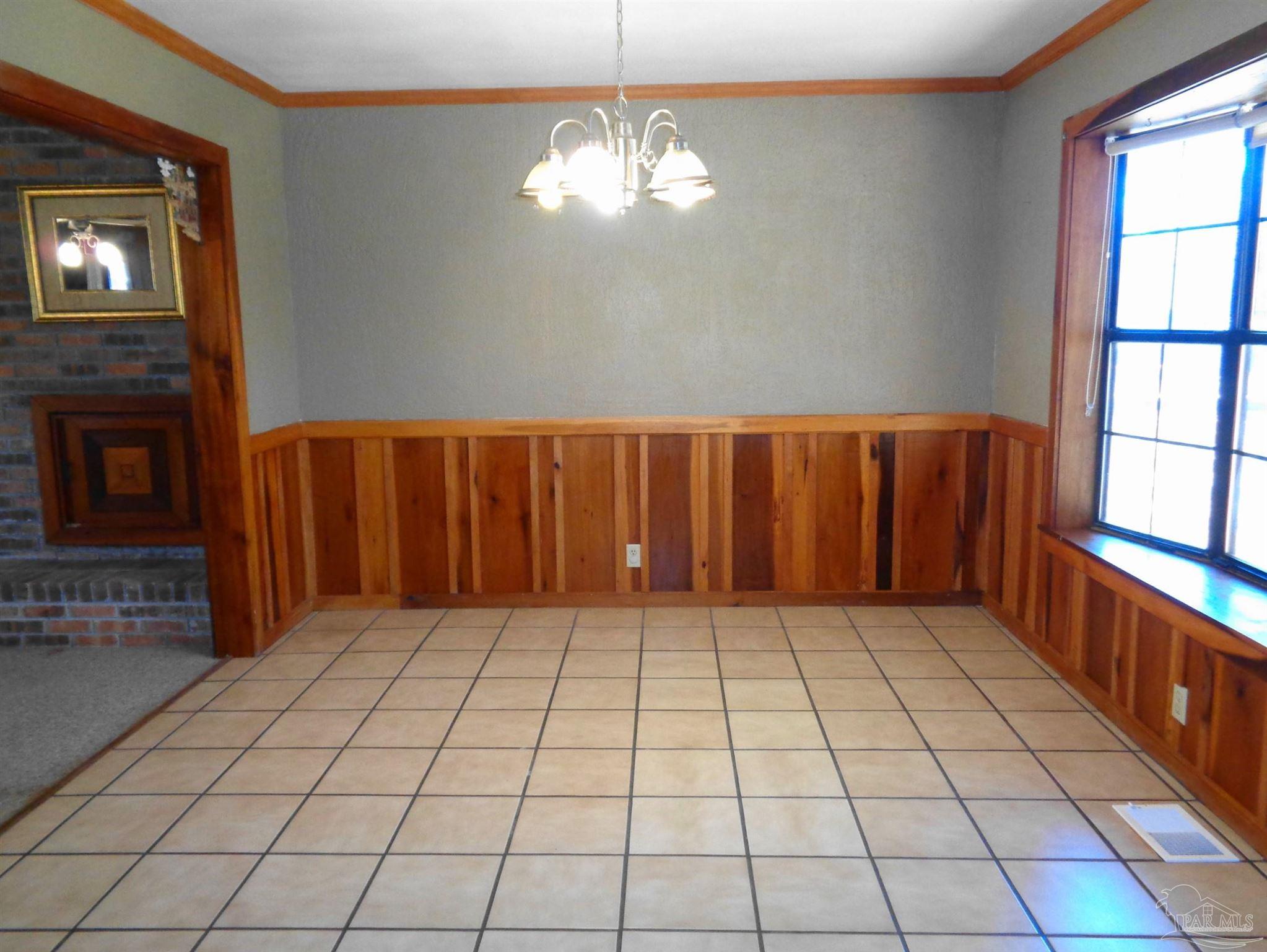 252 S Road Atmore, AL 36502 - Photo 6 of 40 a view of an empty room with a window