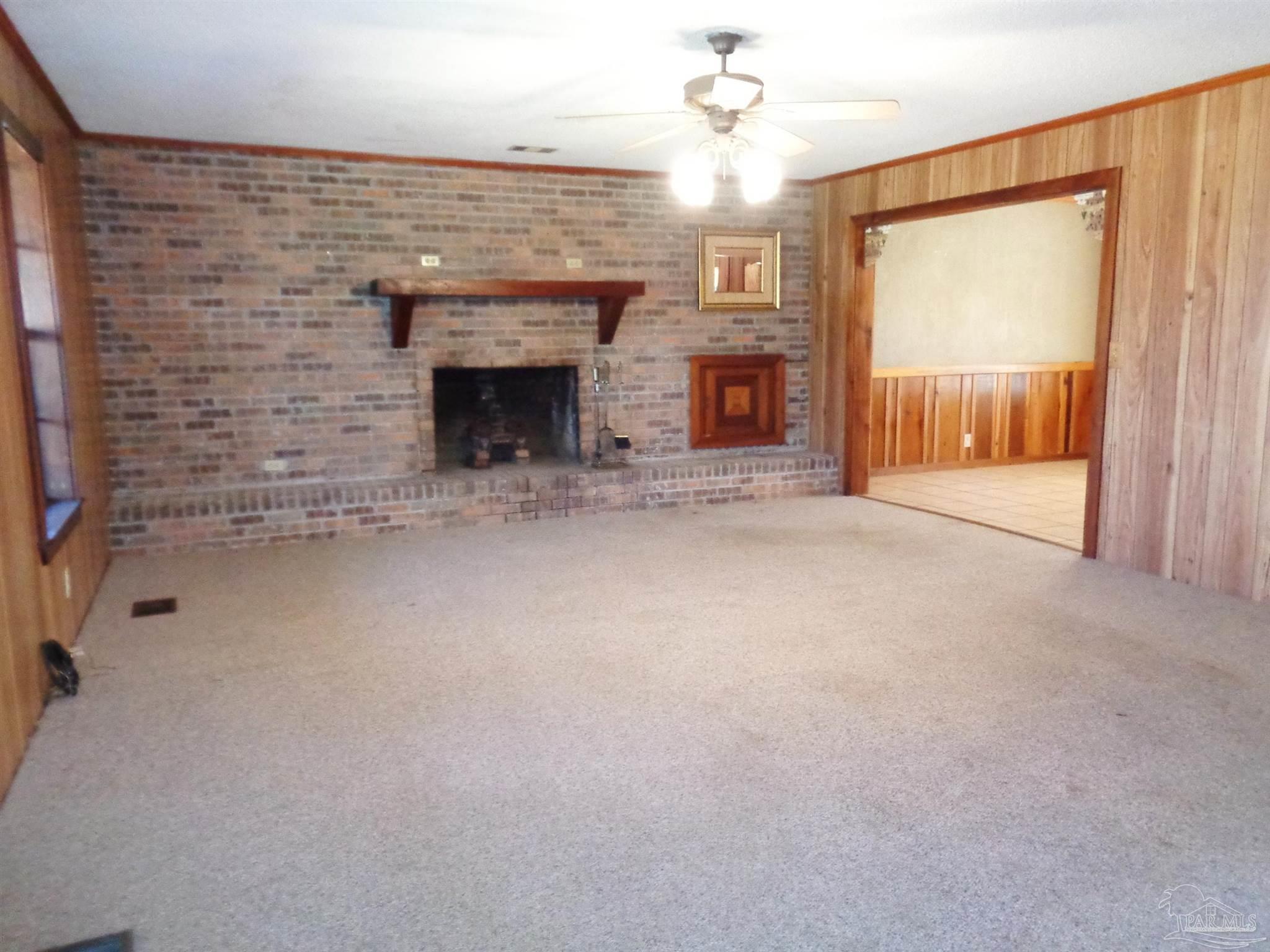 252 S Road Atmore, AL 36502 - Photo 8 of 40 an empty room with windows and fireplace