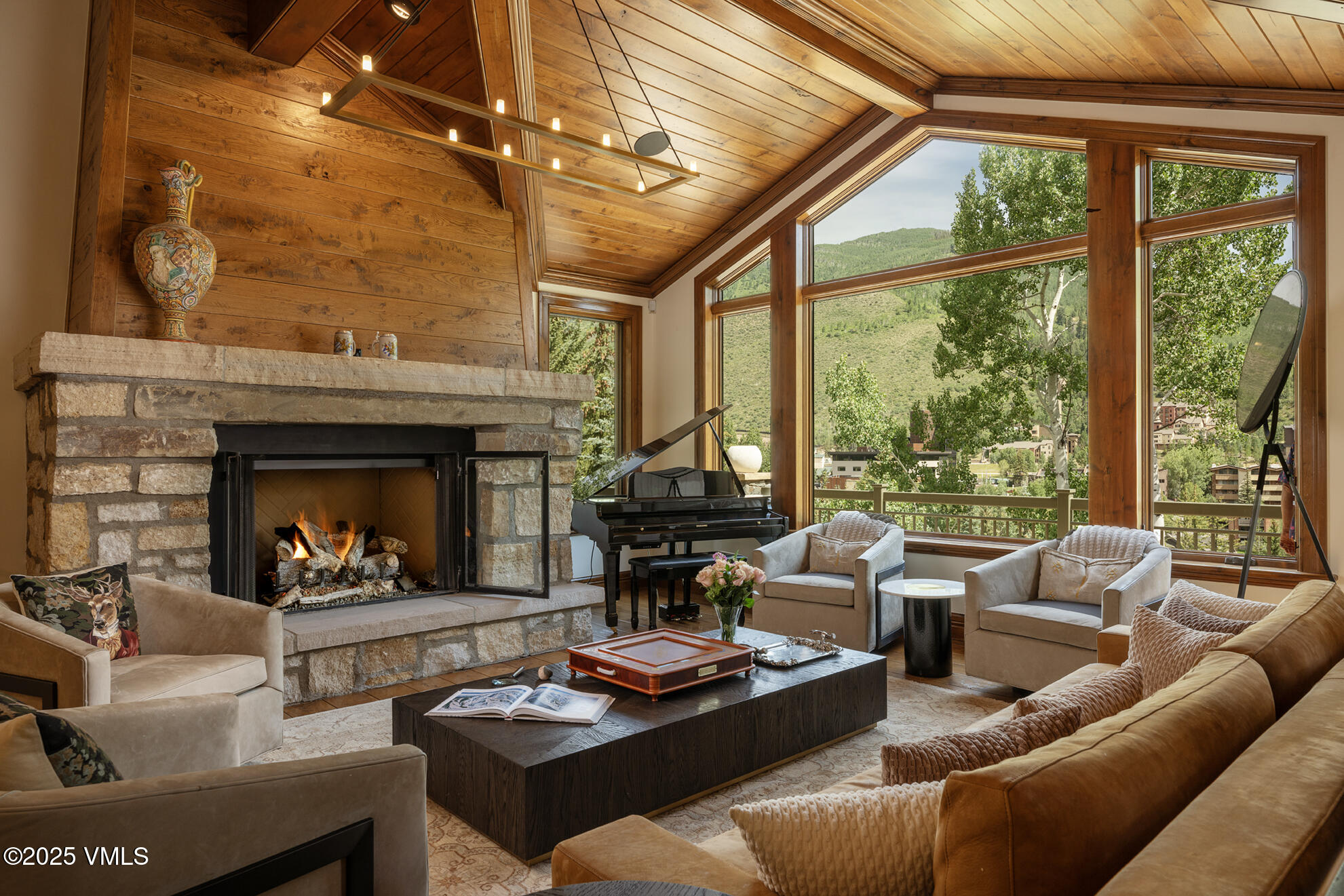 185 Forest Road Vail, CO 81657 - Photo 1 of 13 a living room with furniture and a fireplace