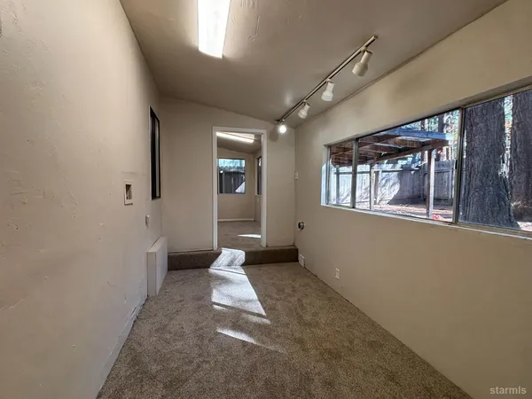 a view of entryway and kitchen