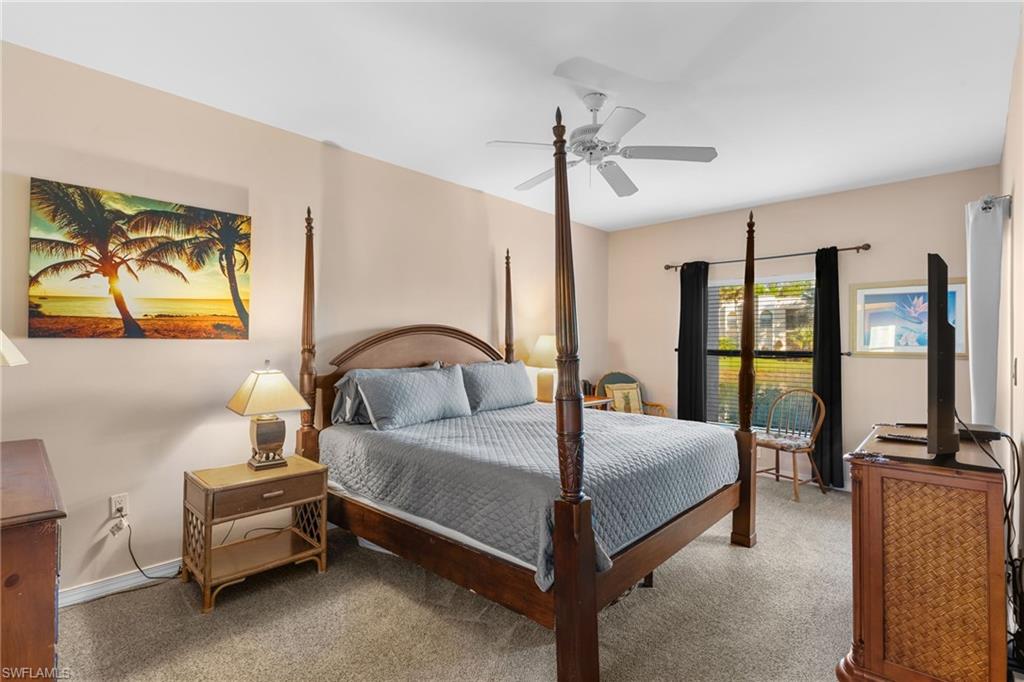 3324 Olympic Drive, Unit 313 Naples, FL 34105 - Photo 15 of 43 a bedroom with a bed and a view of bedroom