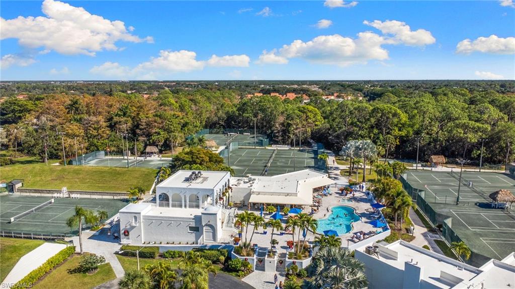 3324 Olympic Drive, Unit 313 Naples, FL 34105 - Photo 26 of 43 a view of a city with lawn chairs