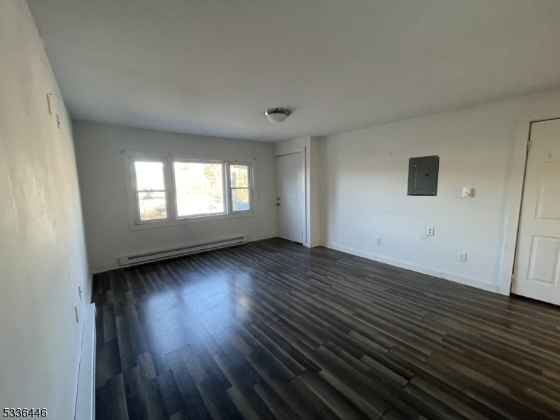 13 Highway 206 Branchville, NJ 07826 - Photo 11 of 29 a view of an empty room with wooden floor and window
