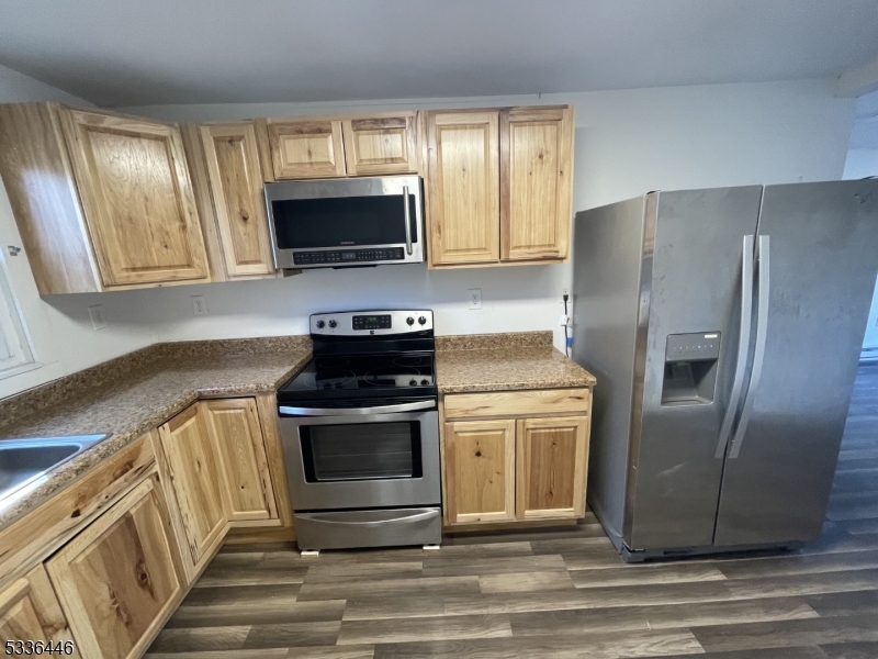 13 Highway 206 Branchville, NJ 07826 - Photo 15 of 29 a kitchen with stainless steel appliances granite countertop a stove a refrigerator and a microwave