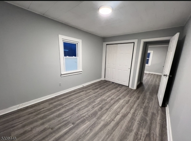 13 Highway 206 Branchville, NJ 07826 - Photo 6 of 29 an empty room with wooden floor and windows