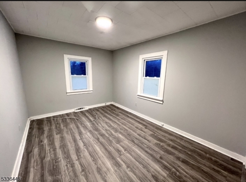 13 Highway 206 Branchville, NJ 07826 - Photo 7 of 29 an empty room with wooden floor and windows