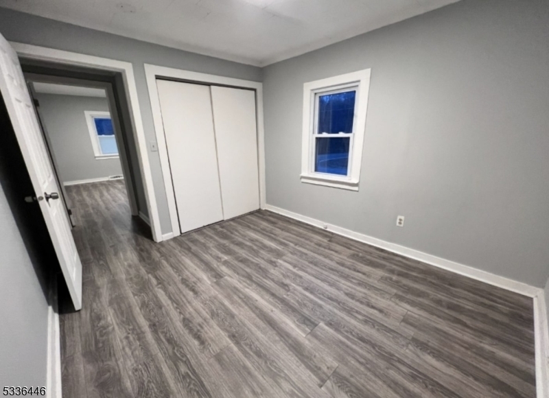 13 Highway 206 Branchville, NJ 07826 - Photo 8 of 29 a view of an empty room with wooden floor and a window