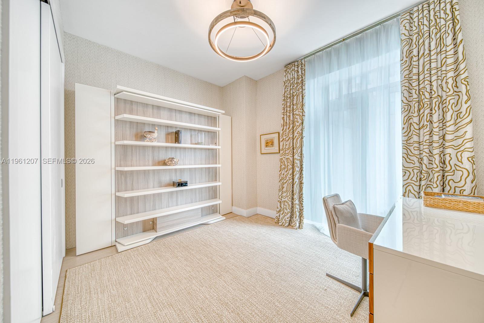 5775 Collins Avenue, Unit 703 Miami Beach, FL 33140 - Photo 38 of 44 a view of a room with shelves and wooden shelves