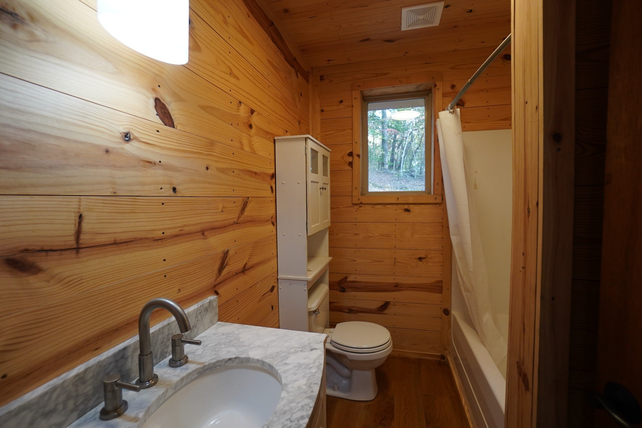 188 Woods Road Dover, TN 37058 - Photo 11 of 31 a bathroom with a sink a toilet and shower