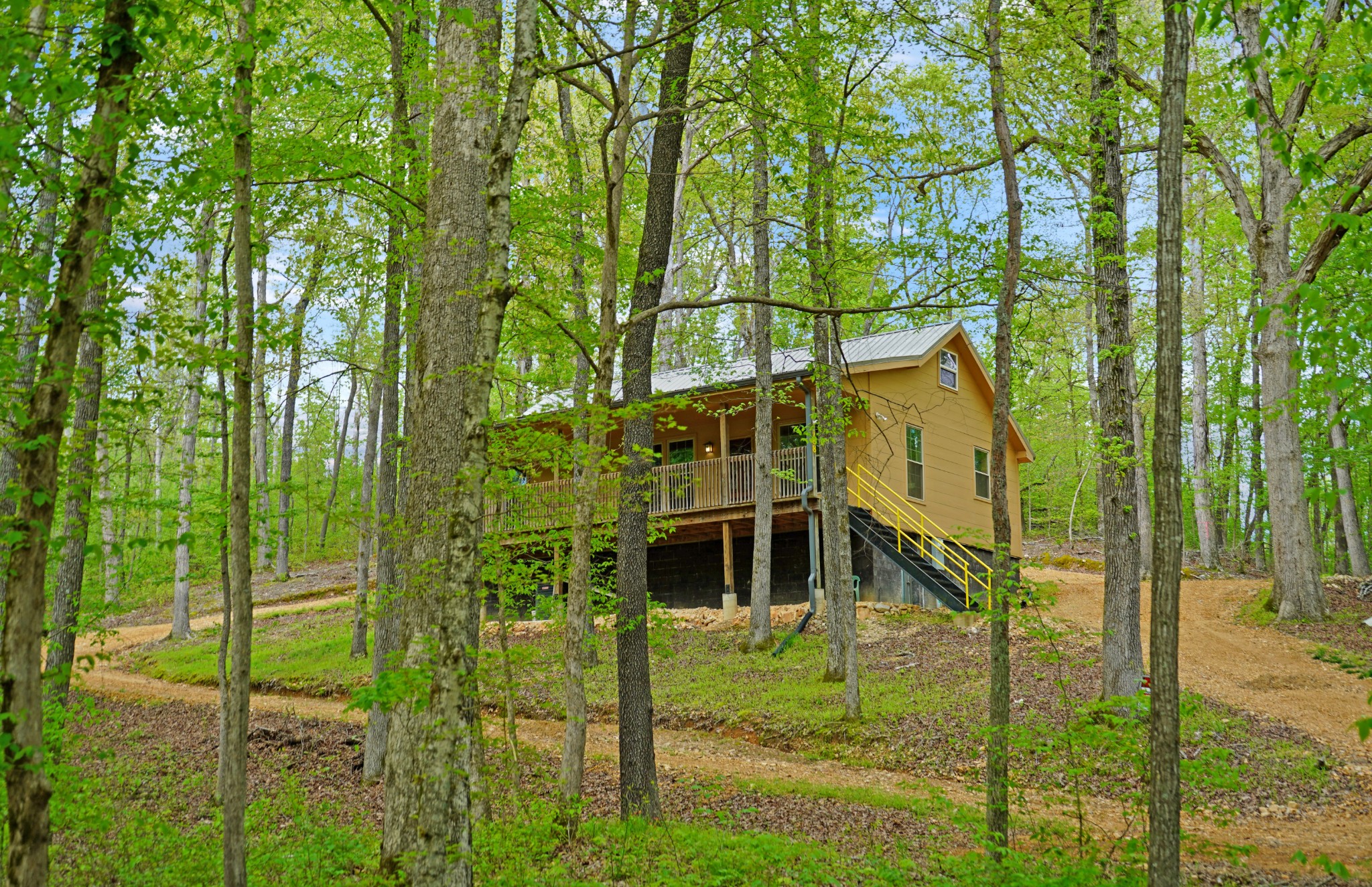 188 Woods Road Dover, TN 37058 - Photo 2 of 31 a yellow building with trees in the background