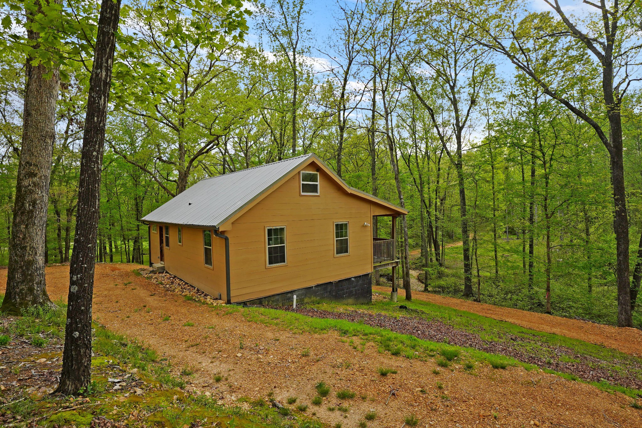 188 Woods Road Dover, TN 37058 - Photo 22 of 31 a view of a barn in the middle of a yard