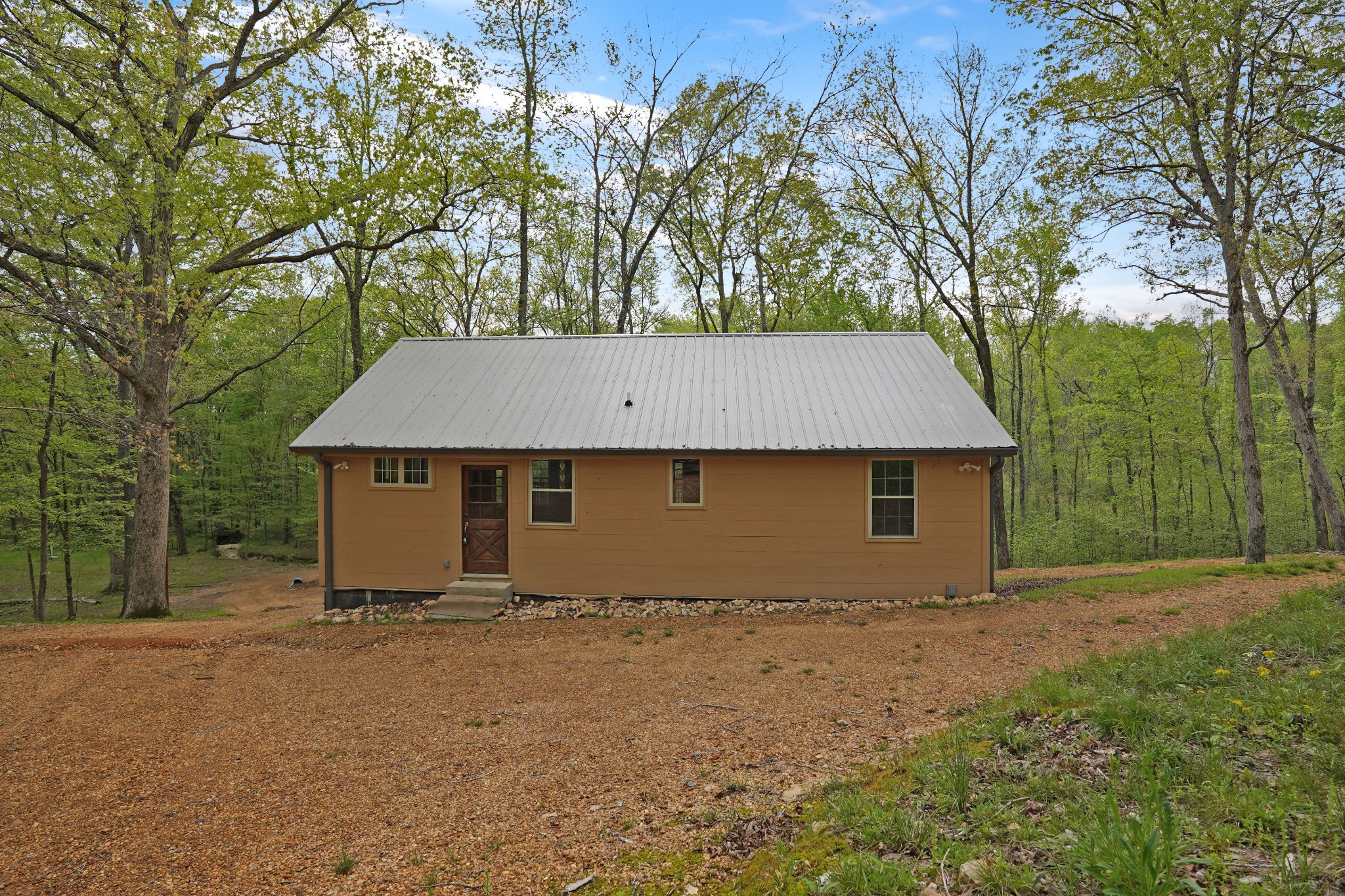 188 Woods Road Dover, TN 37058 - Photo 23 of 31 front view of a house with yard