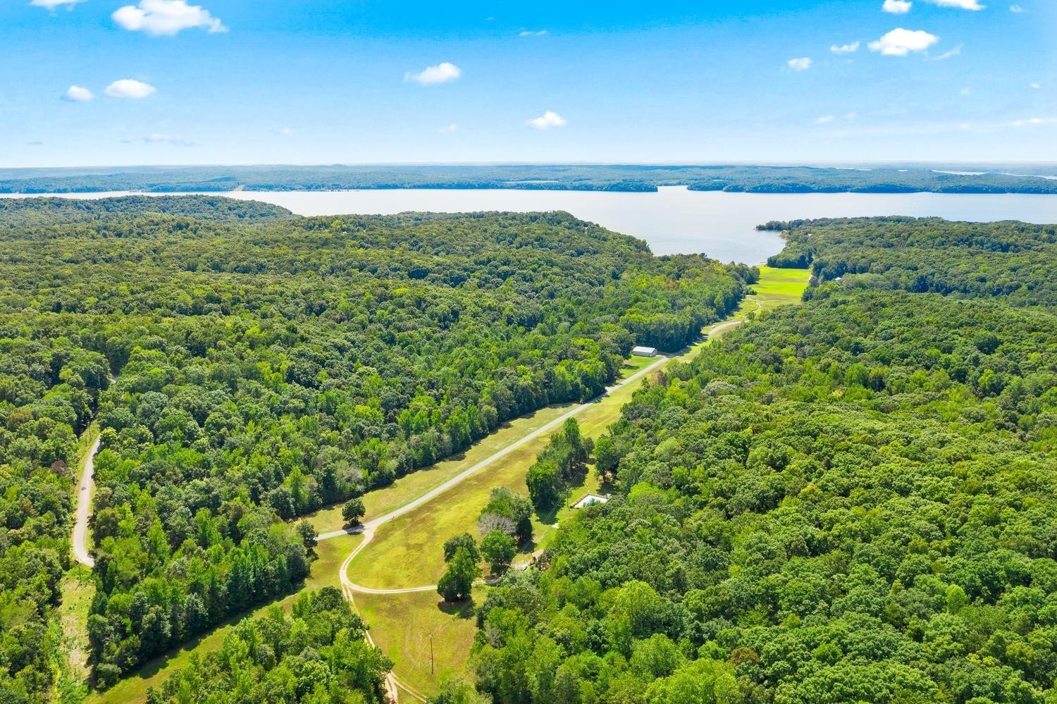 188 Woods Road Dover, TN 37058 - Photo 3 of 31 a view of a lake with a yard