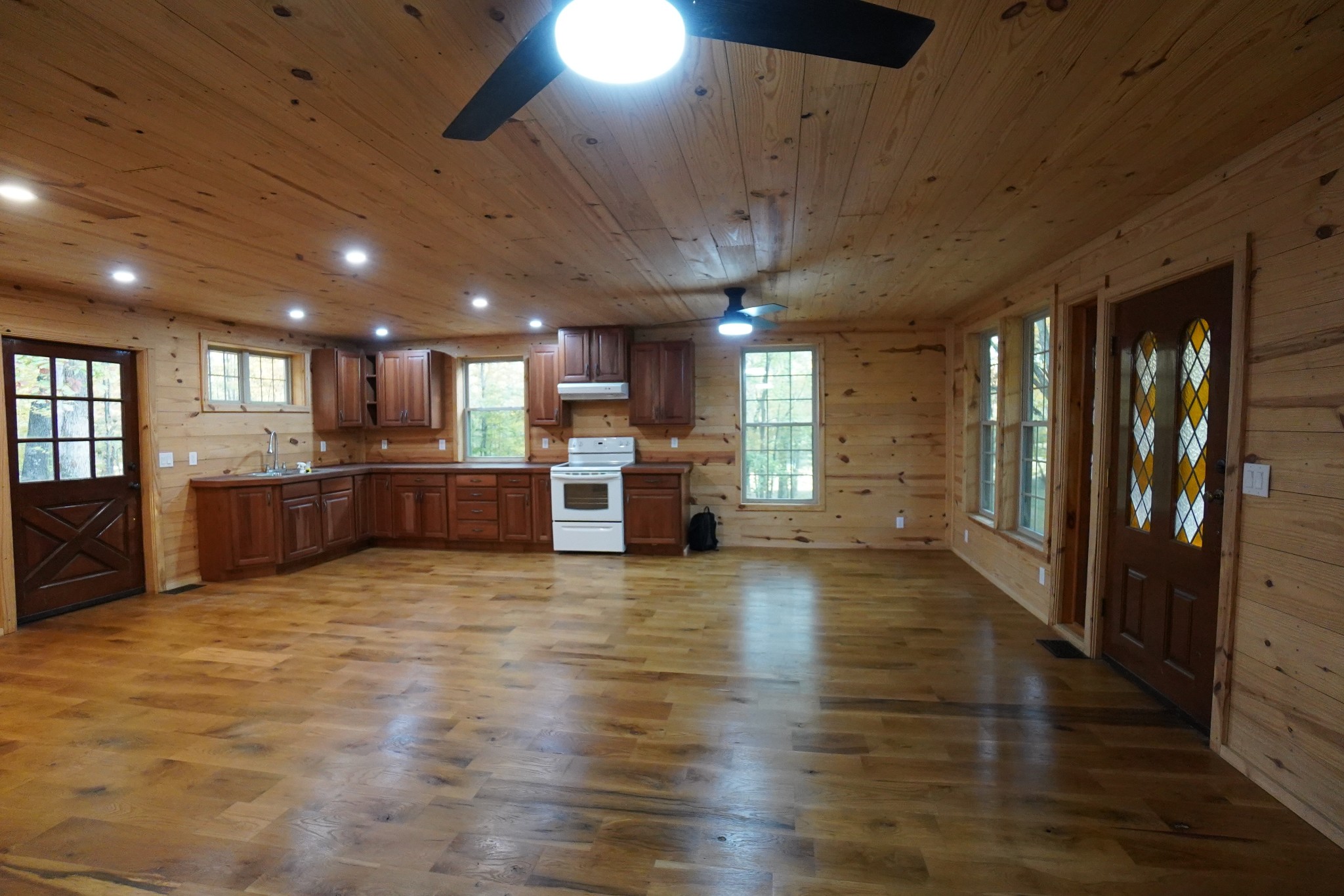188 Woods Road Dover, TN 37058 - Photo 4 of 31 a view of a livingroom with kitchen and a refrigerator