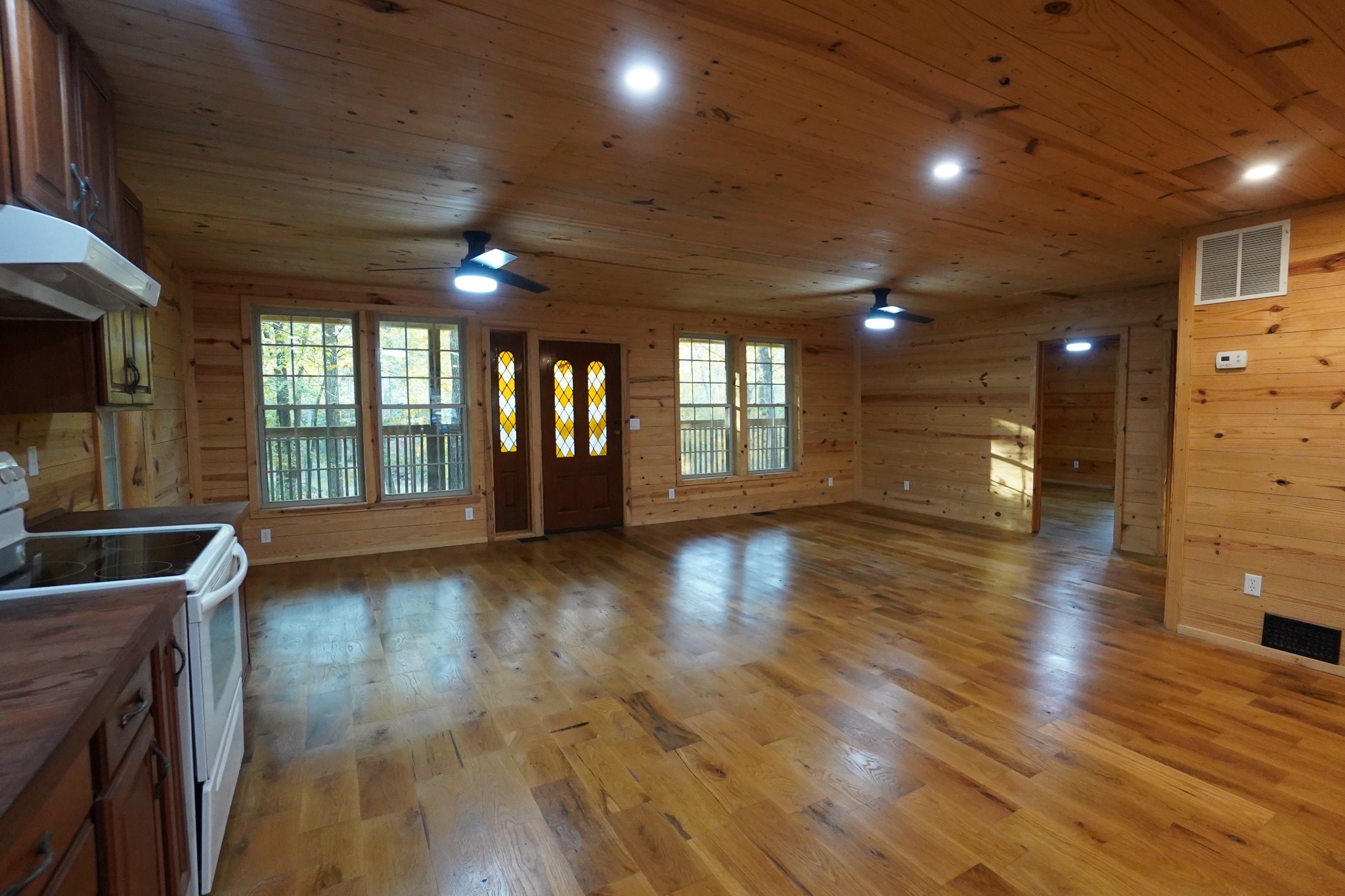 188 Woods Road Dover, TN 37058 - Photo 7 of 31 a view of an empty room with wooden floor and a window