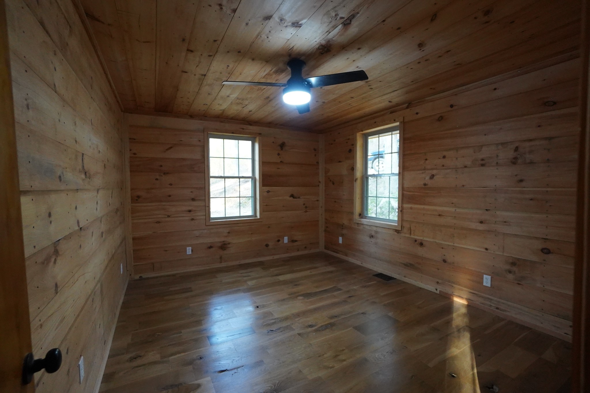 188 Woods Road Dover, TN 37058 - Photo 10 of 31 a view of an empty room with wooden floor and a window