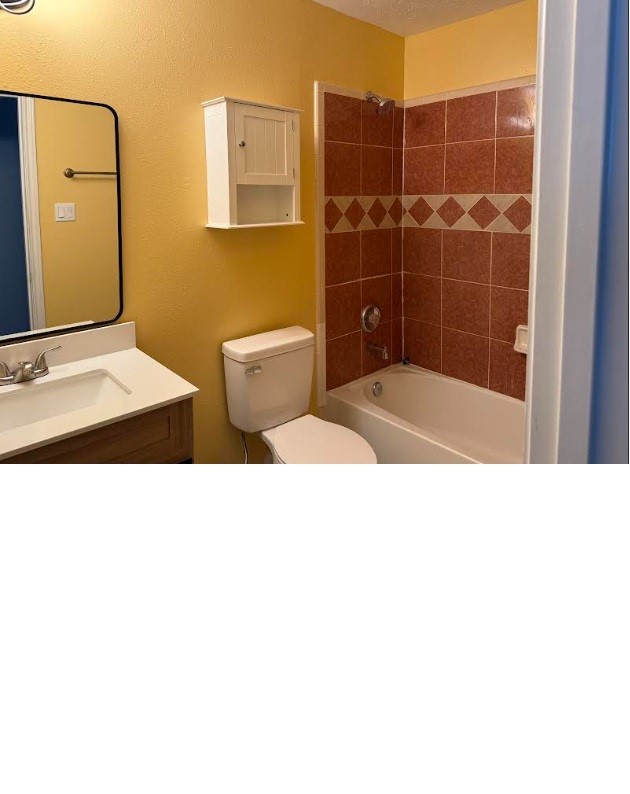 5637 Lotus Street Houston, TX 77085 - Photo 13 of 14 a bathroom with a toilet and a shower