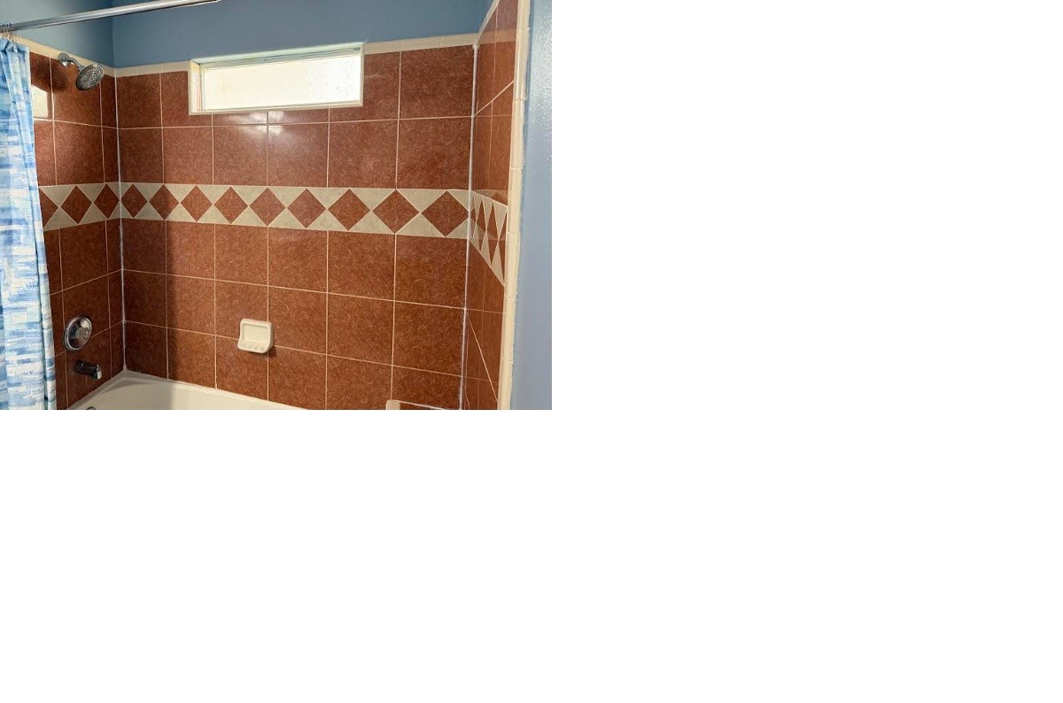 5637 Lotus Street Houston, TX 77085 - Photo 14 of 14 a bathroom with a shower