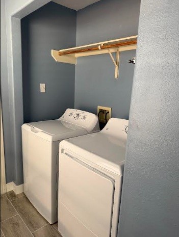 5637 Lotus Street Houston, TX 77085 - Photo 3 of 14 a utility room with dryer and washer