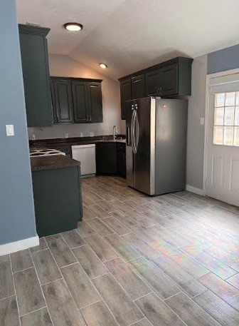 5637 Lotus Street Houston, TX 77085 - Photo 6 of 14 a kitchen with a refrigerator and a sink