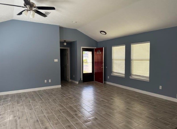 5637 Lotus Street Houston, TX 77085 - Photo 7 of 14 a view of an empty room with a window and wooden floor