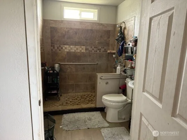 a bedroom with a bed and a mirror