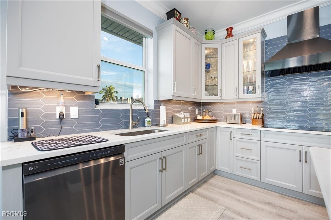 8425 Lagoon Road Fort Myers Beach, FL 33931 - Photo 12 of 49 a kitchen with a sink stove and cabinets