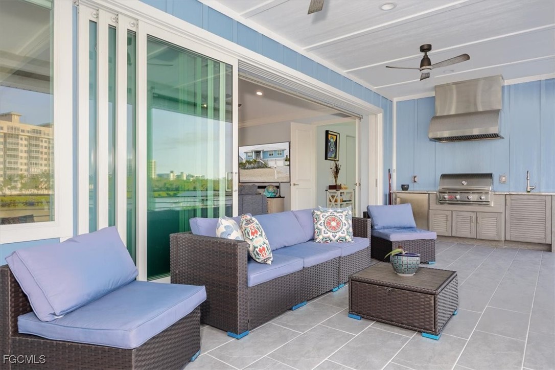 8425 Lagoon Road Fort Myers Beach, FL 33931 - Photo 17 of 49 a living room with furniture and a large window