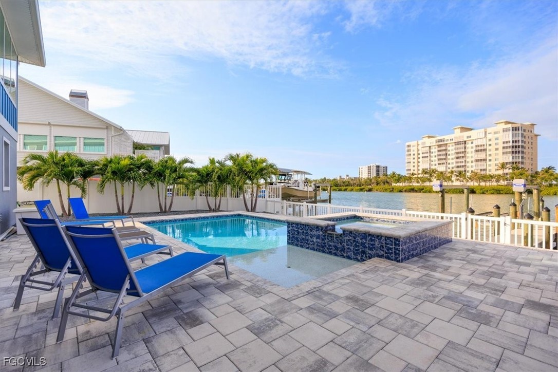 8425 Lagoon Road Fort Myers Beach, FL 33931 - Photo 21 of 49 a view of swimming pool with outdoor seating and plants