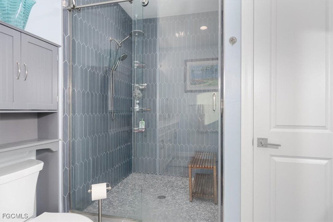 8425 Lagoon Road Fort Myers Beach, FL 33931 - Photo 27 of 49 a bathroom with a shower and a toilet