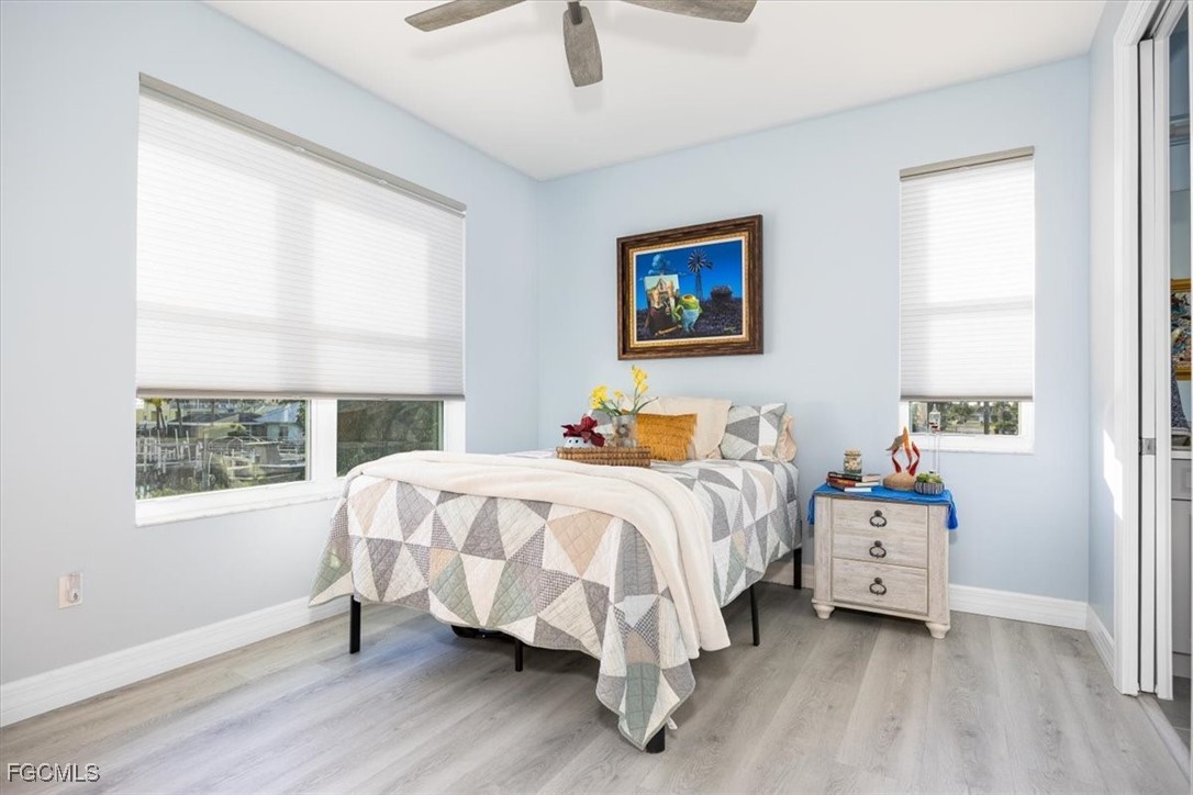 8425 Lagoon Road Fort Myers Beach, FL 33931 - Photo 31 of 49 a bedroom with a bed and a window