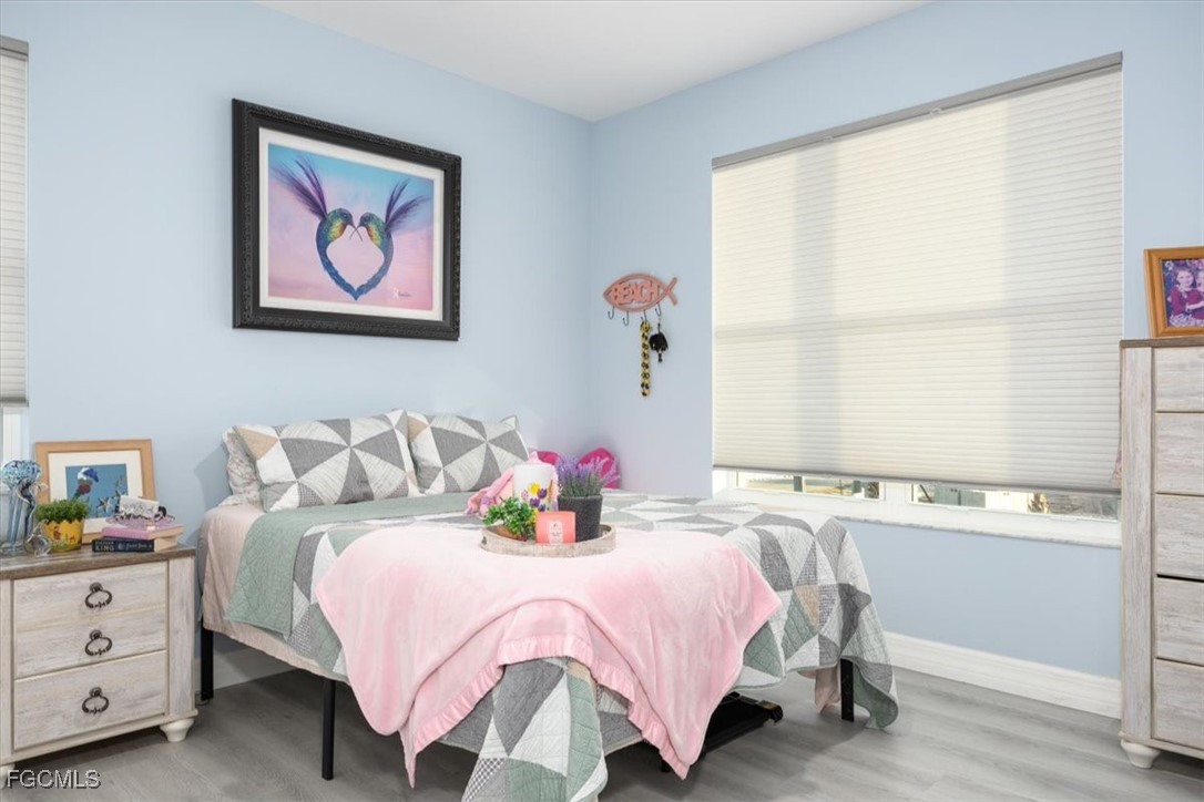 8425 Lagoon Road Fort Myers Beach, FL 33931 - Photo 34 of 49 a bedroom with a bed and a window