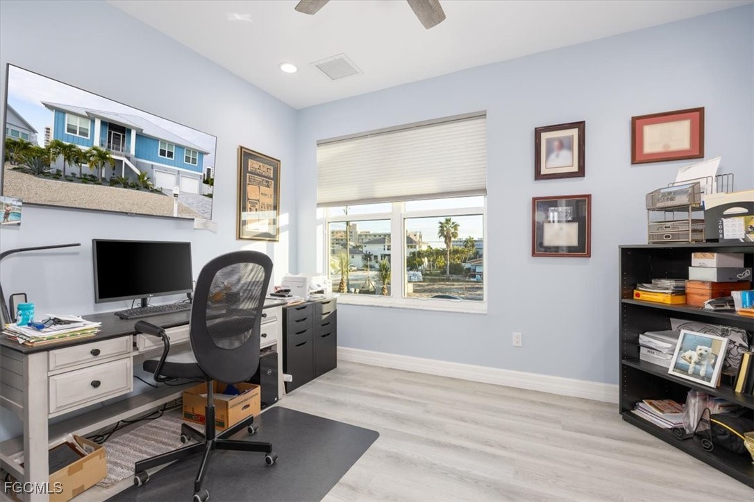8425 Lagoon Road Fort Myers Beach, FL 33931 - Photo 38 of 49 a view of a workspace with furniture and a window