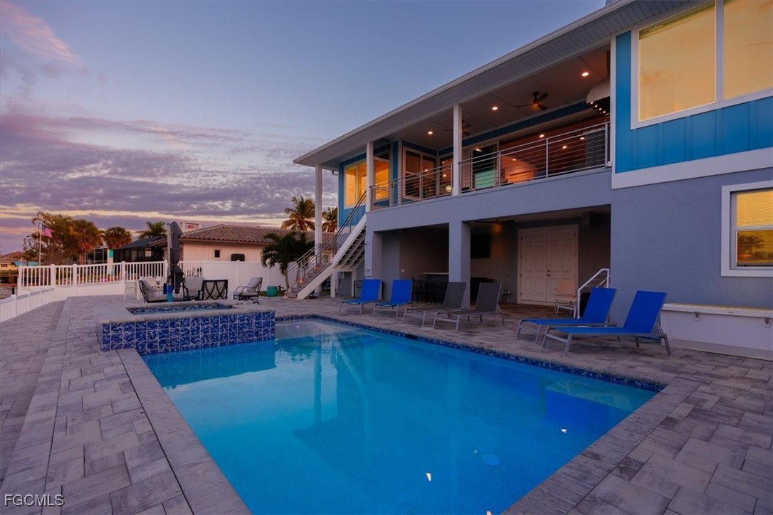 8425 Lagoon Road Fort Myers Beach, FL 33931 - Photo 40 of 49 a view of a house with swimming pool and sitting area