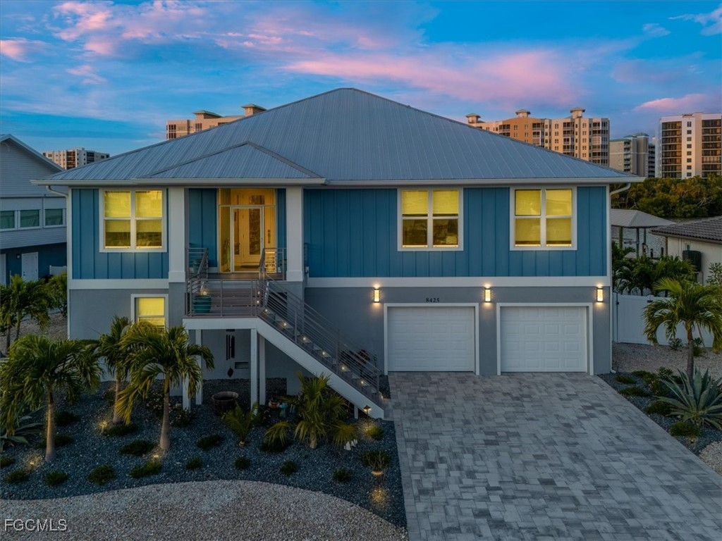 8425 Lagoon Road Fort Myers Beach, FL 33931 - Photo 4 of 49 a view of a house with a patio