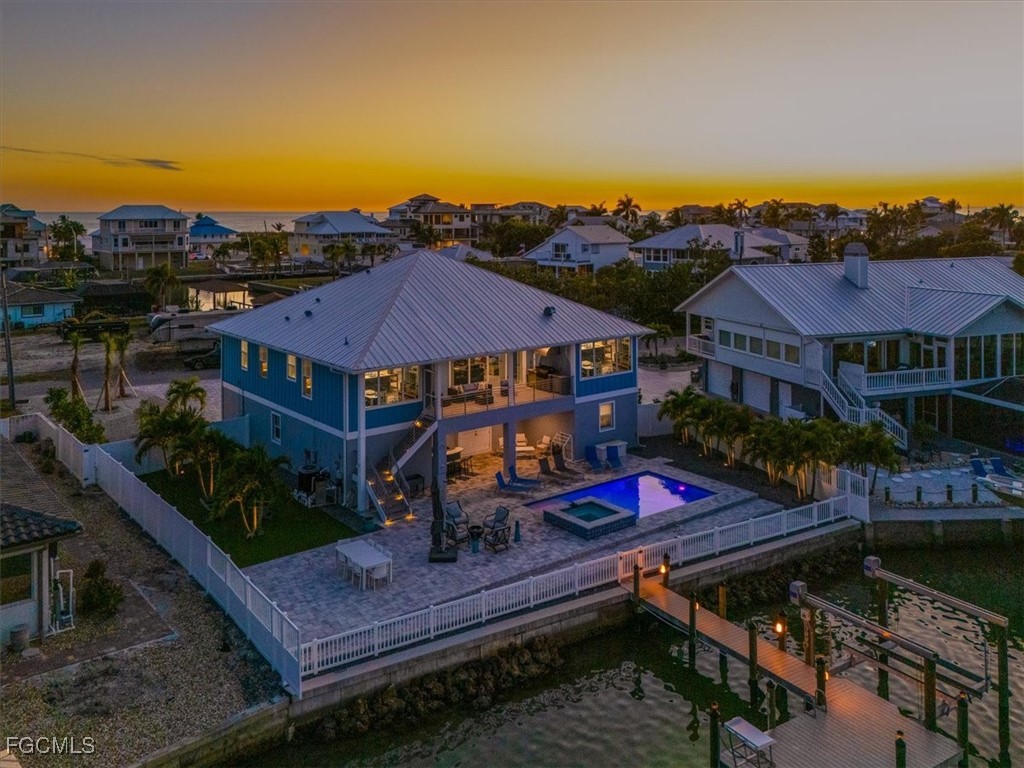 8425 Lagoon Road Fort Myers Beach, FL 33931 - Photo 41 of 49 an aerial view of residential houses and outdoor space