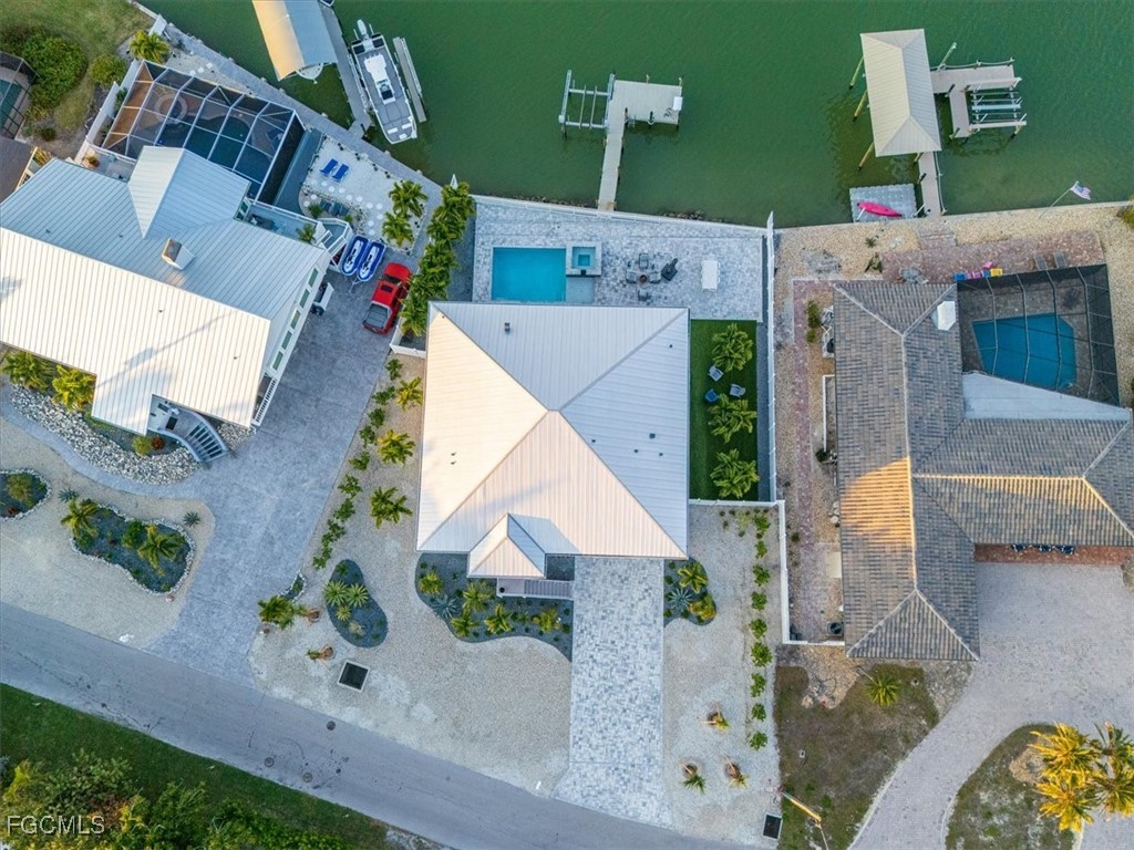 8425 Lagoon Road Fort Myers Beach, FL 33931 - Photo 43 of 49 an aerial view of a house with a garden