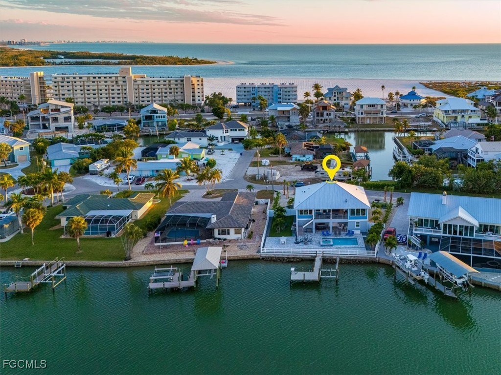 8425 Lagoon Road Fort Myers Beach, FL 33931 - Photo 47 of 49 a view of a city with lawn chairs