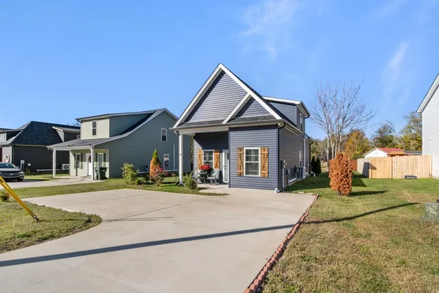 front view of a house with a yard