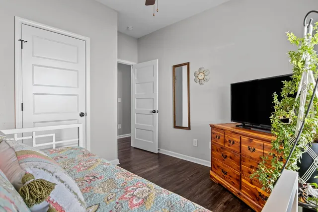 a bedroom with a bed and flat screen tv