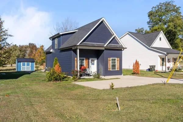 a front view of a house with a yard