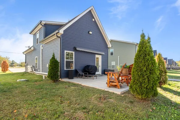 a backyard of a house with seating space