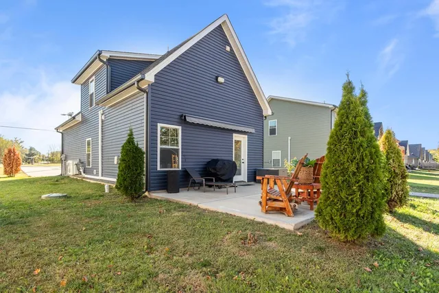 a backyard of a house with seating space