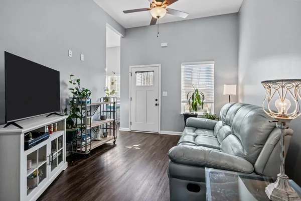 a living room with furniture and a flat screen tv