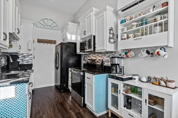 a kitchen with stainless steel appliances a stove and a refrigerator