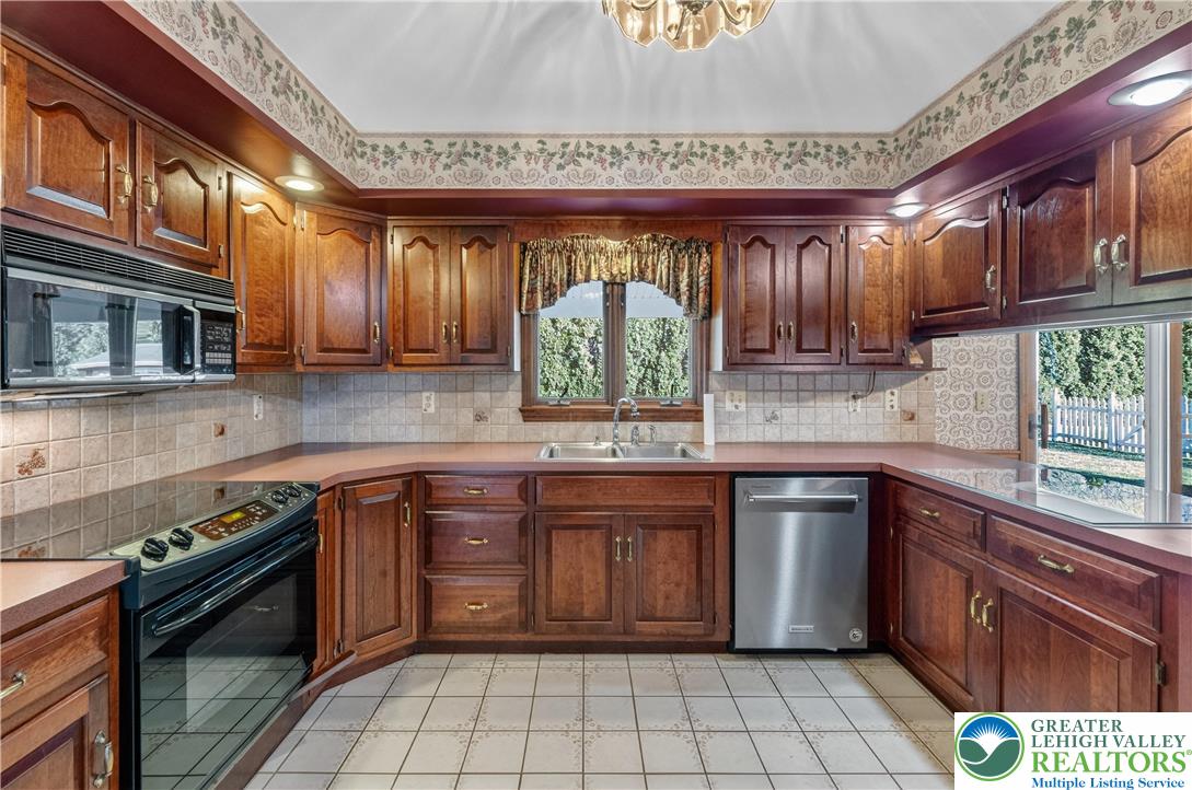 656 Daniels Road Nazareth, PA 18064 - Photo 12 of 54 a kitchen with stainless steel appliances granite countertop a sink a stove a oven a counter space and cabinets