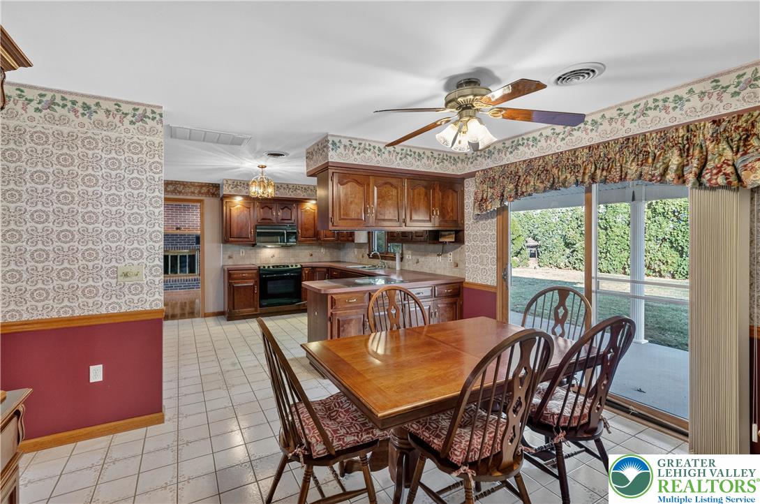 656 Daniels Road Nazareth, PA 18064 - Photo 16 of 54 a dining room with furniture a chandelier and window